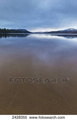 Looking across Loch Laggan on very calm day in winter; Laggan, Scotland View Large Photo Image Stock Photography - Looking across Loch Laggan on very calm day in winter; Laggan, Scotland. Fotosearch
