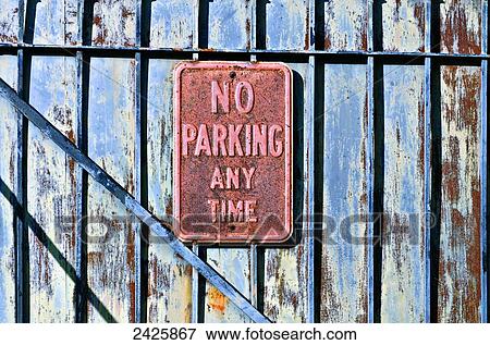 Stock Photo - Louisiana, New Orleans, No Parking sign on gated fence.. Fotosearch