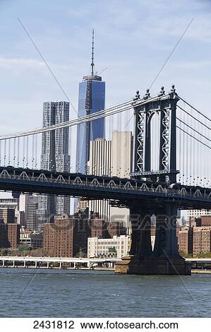 Stock Image - Lower Manhattan and Williamsburg Bridge, as seen from the East River, New York City, New York, United States. Fotosearch