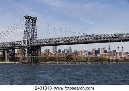 Lower Manhattan and Williamsburg Bridge, as seen from the East River, New York City, New York, United States View Large Photo Image Stock Image - Lower Manhattan and Williamsburg Bridge, as seen from the East River, New York City, New York, United States. Fotosearch