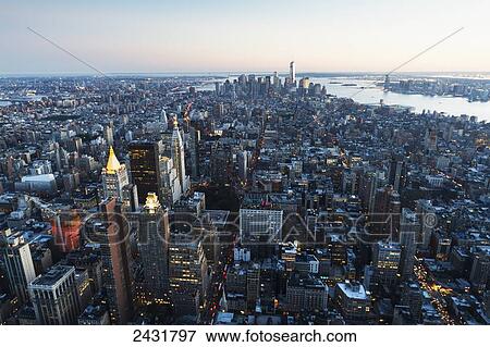 Stock Photo - Lower Manhattan, as seen from the Empire State Building at sunset, New York City, New York, United States. Fotosearch
