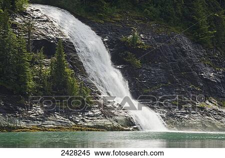 Lower portion of a waterfall emptying into Endicott Arm, fjord in Tracy Arm-Fords Terror Wilderness, South of Juneau; Alaska, United States of America View Large Photo Image Stock Photography - Lower portion of a waterfall emptying into Endicott Arm, fjord in Tracy Arm-Fords Terror Wilderness, South of Juneau; Alaska, United States of America. Fotosearch