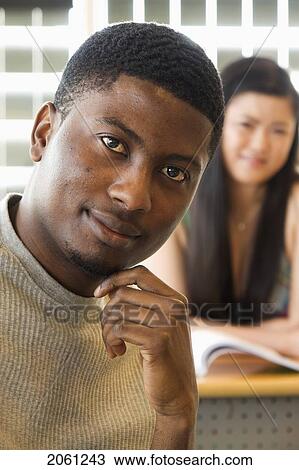 Male Student Foreground, Female Student Background, In Front Of Solar Panelled Windows, Winnipeg, Canada View Large Photo Image Stock Image - Male Student Foreground, Female Student Background, In Front Of Solar Panelled Windows, Winnipeg, Canada. Fotosearch