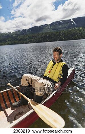 Man in canoe on Byers Lake with forested foothills in the background, Byers lake campground, Denali State Park; Alaska, United States of America View Large Photo Image Stock Photo - Man in canoe on Byers Lake with forested foothills in the background, Byers lake campground, Denali State Park; Alaska, United States of America. Fotosearch