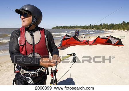 Stock Photo - Man Kite Boarding, Victoria Beach, Manitoba. Fotosearch