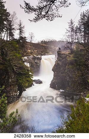 Man looking over The Falls of Pattack on the Ardverikie Estate, near Laggan; Scotland View Large Photo Image Stock Photo - Man looking over The Falls of Pattack on the Ardverikie Estate, near Laggan; Scotland. Fotosearch