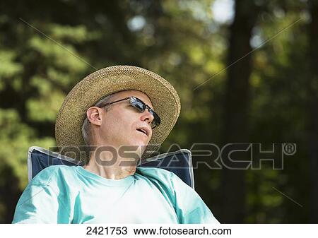 Man sleeping in a park; Edmonton, Alberta, Canada View Large Photo Image Stock Image - Man sleeping in a park; Edmonton, Alberta, Canada. Fotosearch