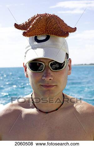 Man With Starfish On His Head, Camaguey, Cuba View Large Photo Image Stock Photo - Man With Starfish On His Head, Camaguey, Cuba. Fotosearch