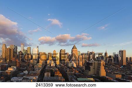 Manhattan cityscape view of skyscrapers and office blocks including the Empire State Building; New York City, New York, United States of America View Large Photo Image Stock Photo - Manhattan cityscape view of skyscrapers and office blocks including the Empire State Building; New York City, New York, United States of America. Fotosearch