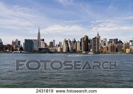 Manhattan skyline, as seen from the East River, New York City, New York, United States View Large Photo Image Stock Photo - Manhattan skyline, as seen from the East River, New York City, New York, United States. Fotosearch