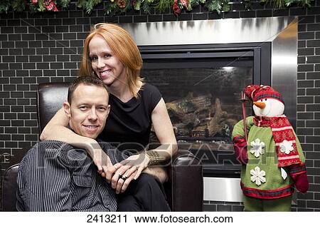 Stock Image - Married couple enjoying time together, wife with a disability; Edmonton, Alberta, Canada. Fotosearch