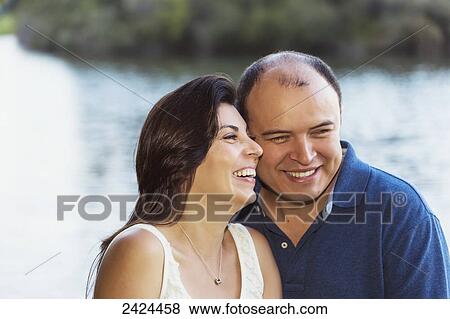 Stock Photo - Married couple in a park spending quality time together; Edmonton, Alberta, Canada. Fotosearch