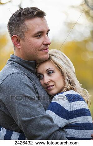 Married couple spending quality time together in a park in autumn; Edmonton, Alberta, Canada View Large Photo Image Stock Image - Married couple spending quality time together in a park in autumn; Edmonton, Alberta, Canada. Fotosearch