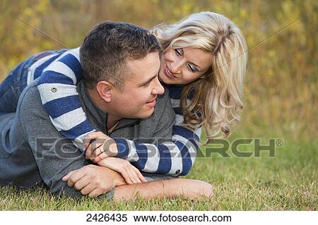 Married couple spending quality time together in a park in autumn; Edmonton, Alberta, Canada View Large Photo Image Stock Photography - Married couple spending quality time together in a park in autumn; Edmonton, Alberta, Canada. Fotosearch
