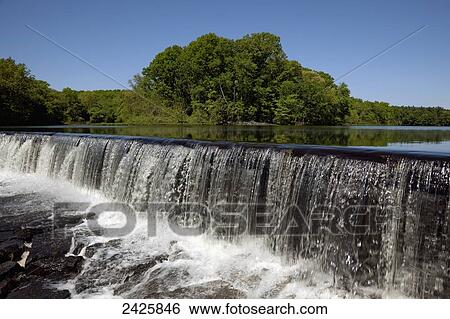 Massachusetts, Northbridge, A waterfall at the edge of very calm lake with reflection. View Large Photo Image Stock Photograph - Massachusetts, Northbridge, A waterfall at the edge of very calm lake with reflection.. Fotosearch