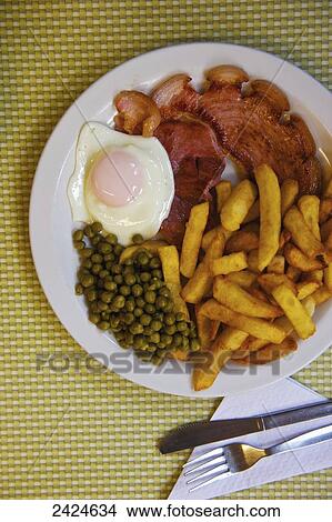 Meal of an egg, french fries and peas; London, England View Large Photo Image Picture - Meal of an egg, french fries and peas; London, England. Fotosearch