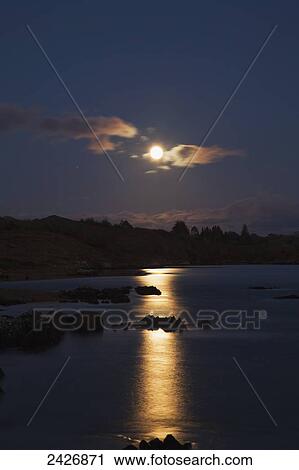 Moonrise reflected in tranquil water; Tahilla, County Kerry, Ireland View Large Photo Image Stock Image - Moonrise reflected in tranquil water; Tahilla, County Kerry, Ireland. Fotosearch