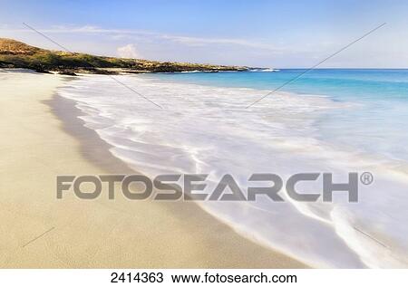Stock Image - Morning surf at Kua Bay beach park; Island of Hawaii, Hawaii, United States of America. Fotosearch