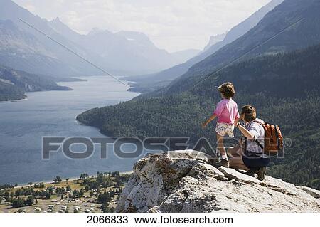Mother And Daughter Enjoy View At Waterton Lakes National Park, Alberta Canada View Large Photo Image Stock Image - Mother And Daughter Enjoy View At Waterton Lakes National Park, Alberta Canada. Fotosearch