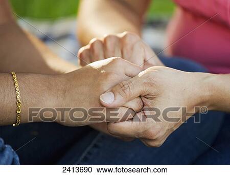 Mother and daughter praying together in a park; Edmonton, Alberta, Canada View Large Photo Image Stock Image - Mother and daughter praying together in a park; Edmonton, Alberta, Canada. Fotosearch