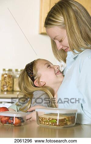 Mother And Daughter Preparing A Healthy Pack Lunch View Large Photo Image Stock Photograph - Mother And Daughter Preparing A Healthy Pack Lunch. Fotosearch