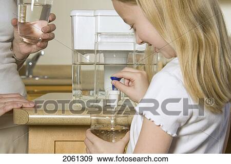 Mother And Daughter Sharing Filtered Water View Large Photo Image Stock Photo - Mother And Daughter Sharing Filtered Water. Fotosearch