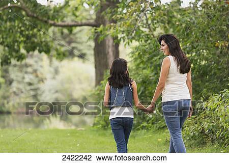 Stock Image - Mother and daughter spending quality time together in a park; Edmonton, Alberta, Canada. Fotosearch