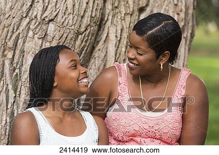 Stock Photo - Mother and daughter spending quality time in a park; Edmonton, Alberta, Canada. Fotosearch