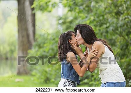 Mother and daughter spending quality time together in a park; Edmonton, Alberta, Canada View Large Photo Image Stock Photo - Mother and daughter spending quality time together in a park; Edmonton, Alberta, Canada. Fotosearch