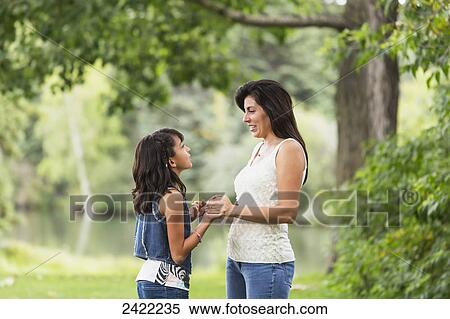Stock Photography - Mother and daughter spending quality time together in a park; Edmonton, Alberta, Canada. Fotosearch