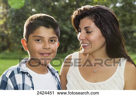 Stock Image - Mother and son spending quality time together in a park; Edmonton, Alberta, Canada. Fotosearch