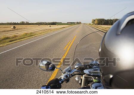 Motorcyclist riding on the highway, near Edmonton; Alberta, Canada View Large Photo Image Picture - Motorcyclist riding on the highway, near Edmonton; Alberta, Canada. Fotosearch