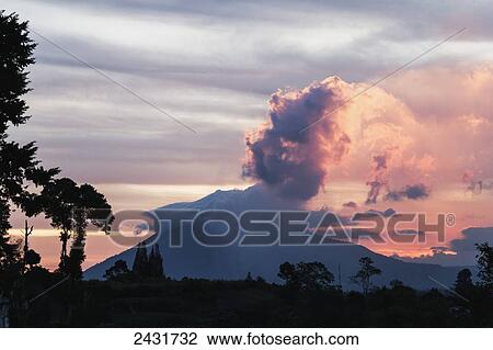 Stock Image - Mount Sinabung stratovolcano at sunset, North Sumatra, Indonesia. Fotosearch