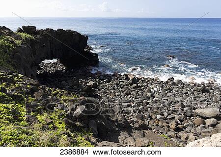 Natural arch at Kaena Point along the coastline; Oahu, Hawaii, United States of America View Large Photo Image Picture - Natural arch at Kaena Point along the coastline; Oahu, Hawaii, United States of America. Fotosearch