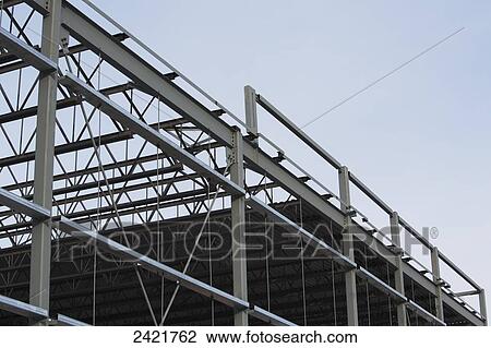Stock Image - New commercial warehouse building being erected with structural steel; Edmonton, Alberta, Canada. Fotosearch