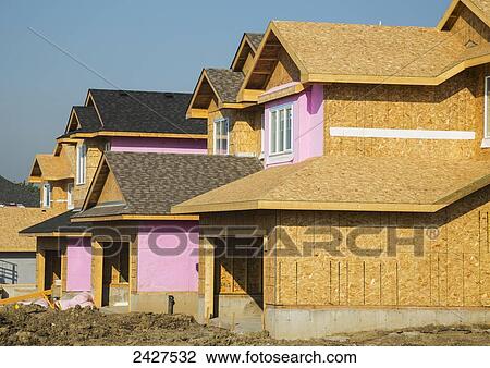 New homes under construction in a residential area; St. Albert, Alberta, Canada View Large Photo Image Stock Image - New homes under construction in a residential area; St. Albert, Alberta, Canada. Fotosearch