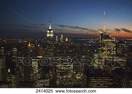 New York City buildings illuminated at nighttime; New York City, New York, United States of America View Large Photo Image Stock Photography - New York City buildings illuminated at nighttime; New York City, New York, United States of America. Fotosearch