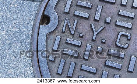 New York City sewer manhole cover with detail of NYC letters; New York City, New York, United States of America View Large Photo Image Stock Photo - New York City sewer manhole cover with detail of NYC letters; New York City, New York, United States of America. Fotosearch