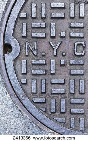 New York City sewer manhole cover with detail of NYC letters; New York City, New York, United States of America View Large Photo Image Stock Photograph - New York City sewer manhole cover with detail of NYC letters; New York City, New York, United States of America. Fotosearch