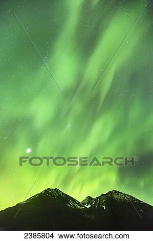 Northern Lights in the sky above Moose Pass, with silhouetted Kenai Mountains in the foreground, Chugach National Forest; Moose Pass, Alaska, United States of America View Large Photo Image Picture - Northern Lights in the sky above Moose Pass, with silhouetted Kenai Mountains in the foreground, Chugach National Forest; Moose Pass, Alaska, United States of America. Fotosearch