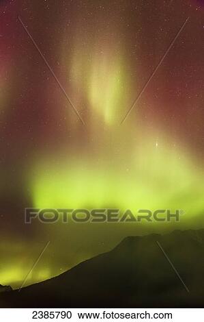 Northern Lights in the sky above Moose Pass, silhouetted Kenai Mountains in the foreground with fog and low cloud, Chugach National Forest; Alaska, United States of America View Large Photo Image Stock Image - Northern Lights in the sky above Moose Pass, silhouetted Kenai Mountains in the foreground with fog and low cloud, Chugach National Forest; Alaska, United States of America. Fotosearch