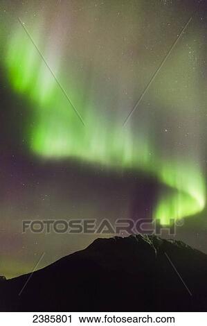 Northern Lights in the sky above Moose Pass, with silhouetted Kenai Mountains in the foreground, Chugach National Forest; Moose Pass, Alaska, United States of America View Large Photo Image Stock Image - Northern Lights in the sky above Moose Pass, with silhouetted Kenai Mountains in the foreground, Chugach National Forest; Moose Pass, Alaska, United States of America. Fotosearch