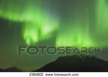 Northern Lights in the sky above Moose Pass, with silhouetted Kenai Mountains in the fog and low cloud, Chugach National Forest; Moose Pass, Alaska, United States of America View Large Photo Image Stock Image - Northern Lights in the sky above Moose Pass, with silhouetted Kenai Mountains in the fog and low cloud, Chugach National Forest; Moose Pass, Alaska, United States of America. Fotosearch