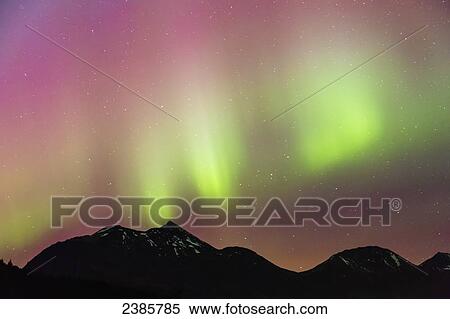 Northern Lights in the sky above Moose Pass, silhouetted Kenai Mountains in the foreground, Chugach National Forest; Alaska, United States of America View Large Photo Image Stock Photography - Northern Lights in the sky above Moose Pass, silhouetted Kenai Mountains in the foreground, Chugach National Forest; Alaska, United States of America. Fotosearch