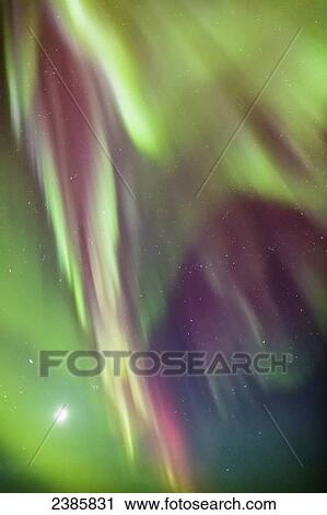 Stock Image - Northern Lights in the sky above the Tony Knowles Coastal Trail, Anchorage Coastal Refuge; Anchorage, Alaska, United States of America. Fotosearch