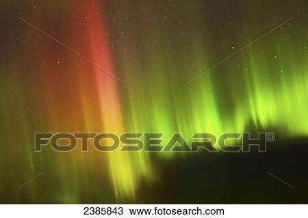 Stock Image - Northern Lights in the sky above the Tony Knowles Coastal Trail; Alaska, United States of America. Fotosearch