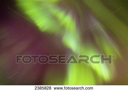 Stock Photo - Northern Lights in the sky above the Tony Knowles Coastal Trail, Anchorage Coastal Refuge; Anchorage, Alaska, United States of America. Fotosearch