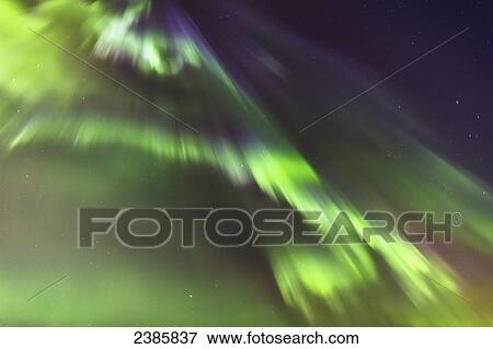 Stock Photo - Northern Lights in the sky above the Tony Knowles Coastal Trail, Anchorage Coastal Refuge; Anchorage, Alaska, United States of America. Fotosearch