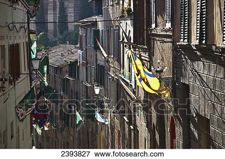 Numerous flags mounted on the sides of buildings; Siena, Italy View Large Photo Image Stock Photo - Numerous flags mounted on the sides of buildings; Siena, Italy. Fotosearch