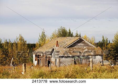 Stock Photo - Old abandoned farmstead in rural Alberta; St. Albert, Alberta, Canada. Fotosearch